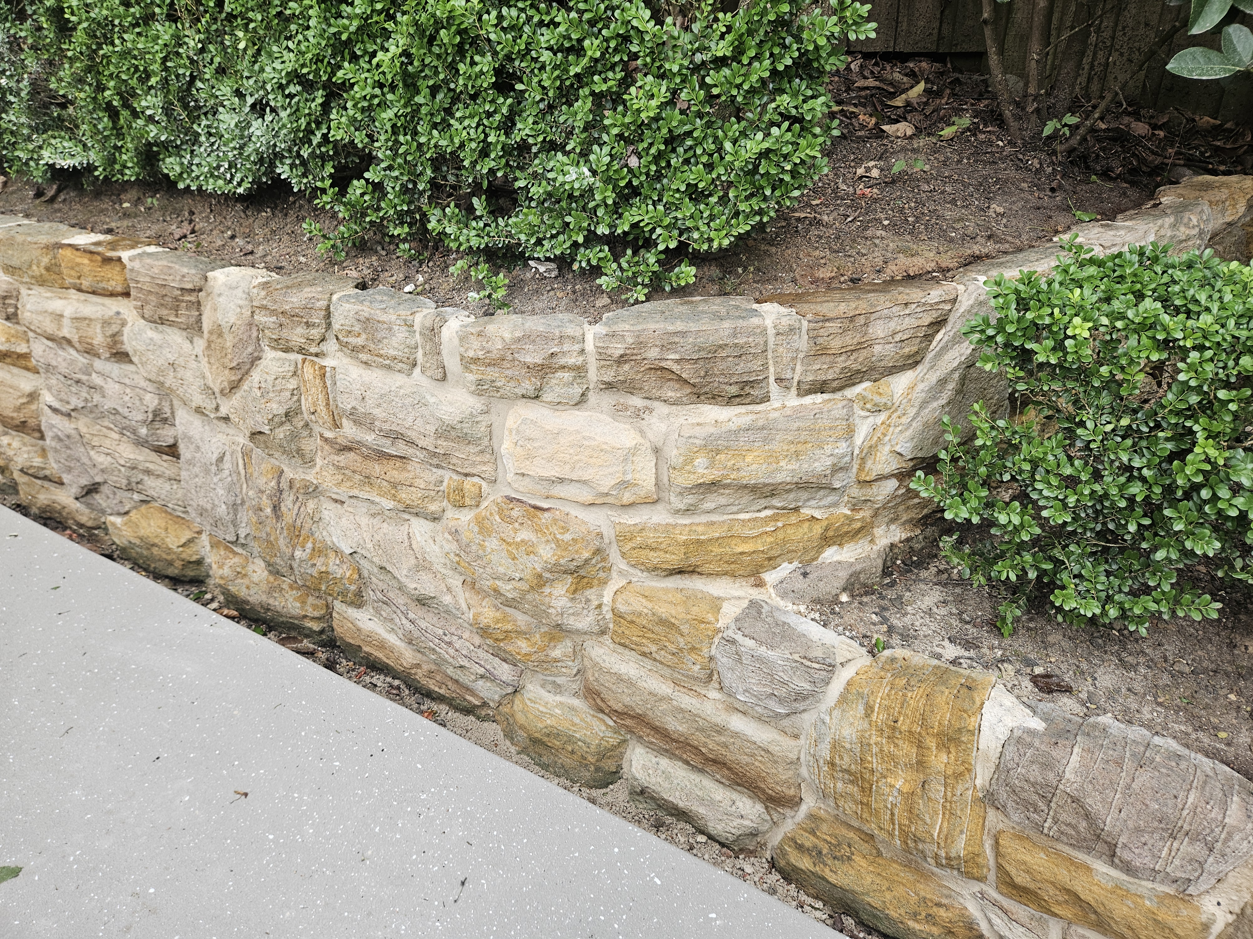 Finished sandstone garden wall